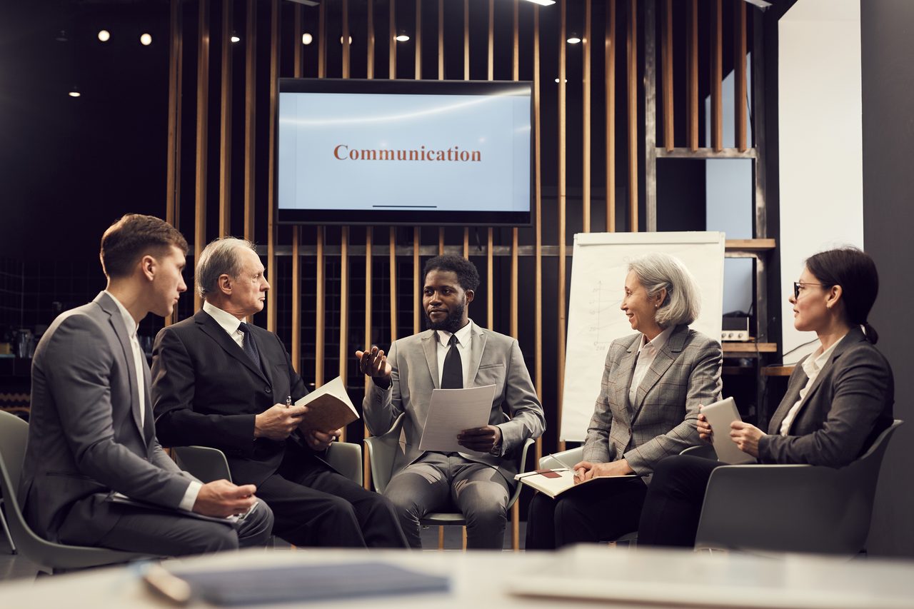 Professionals in a communications training discussion