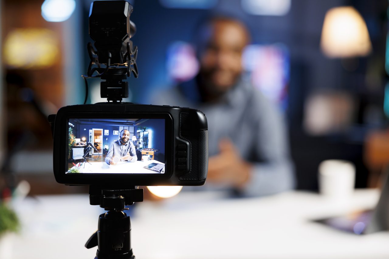 A professional recording video content in a studio
