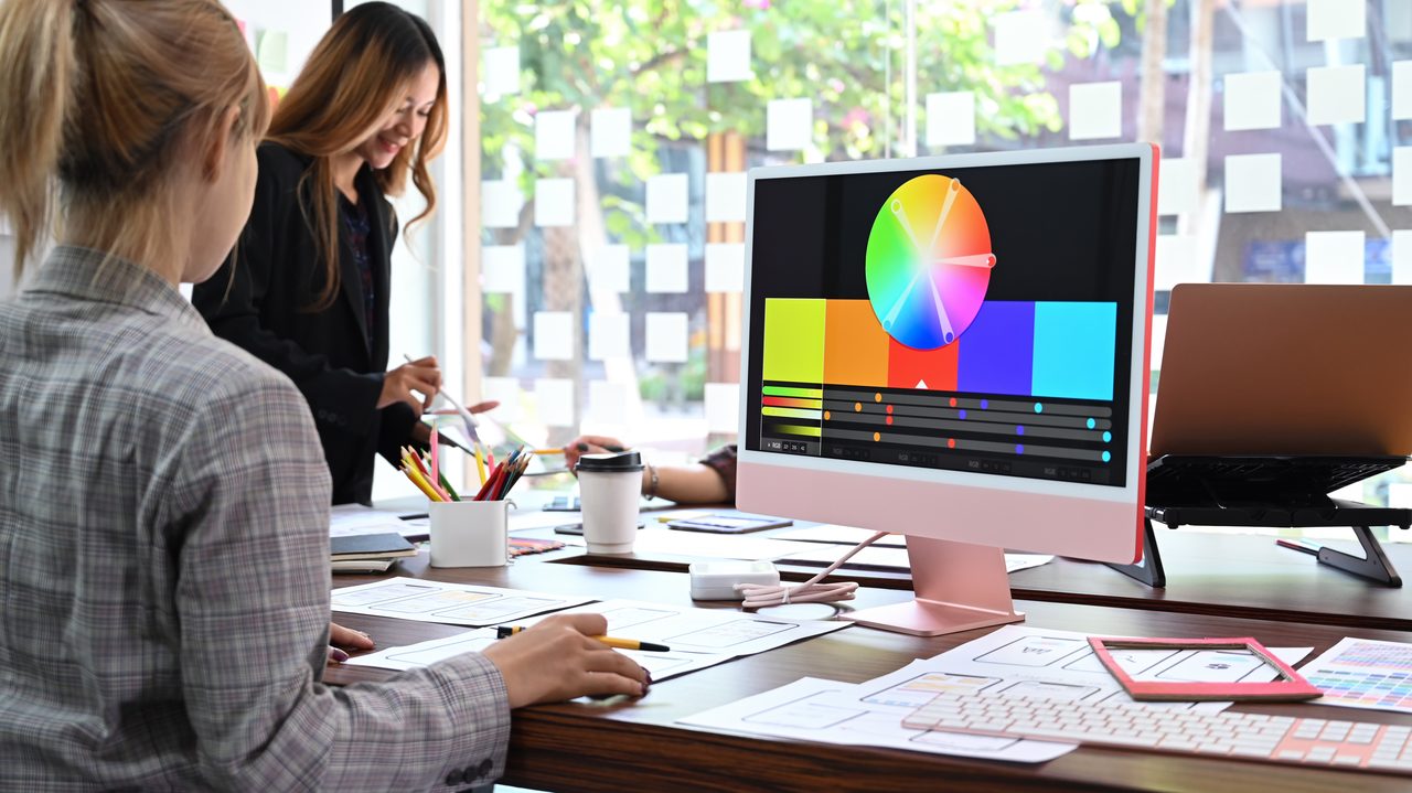 A creative team reviewing color palettes and design work