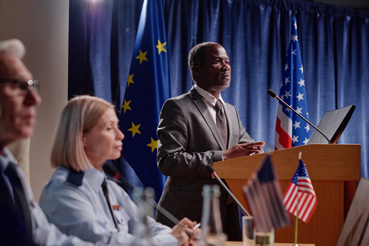 A speaker at a public affairs podium